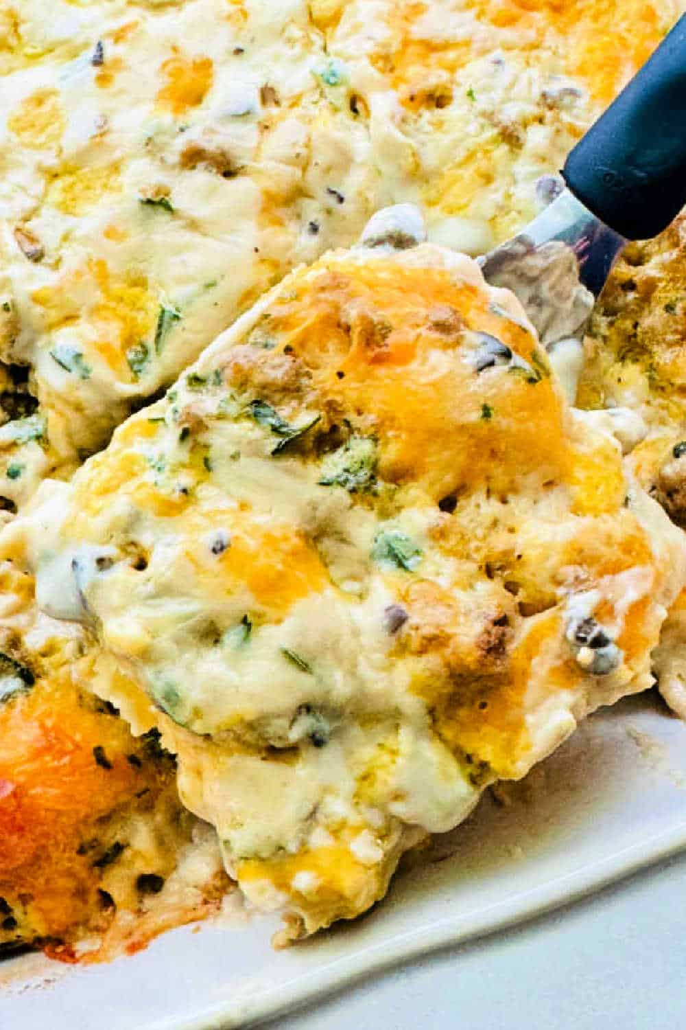 This easy sausage biscuits and gravy casserole recipe will be an absolute hit for either a special occasion or lazy weekend morning. via @foodtasticmom