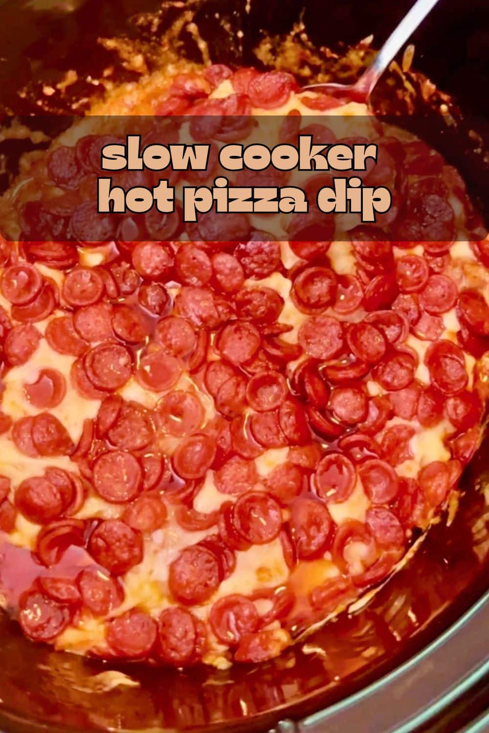 This is an easy cheesy hot pizza dip recipe that is made for the slow cooker! A perfect appetizer that will be a huge hit at your next gathering. via @foodtasticmom
