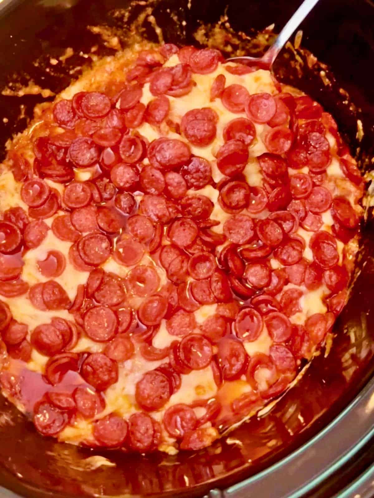 hot pizza dip ready to serve from the slow cooker