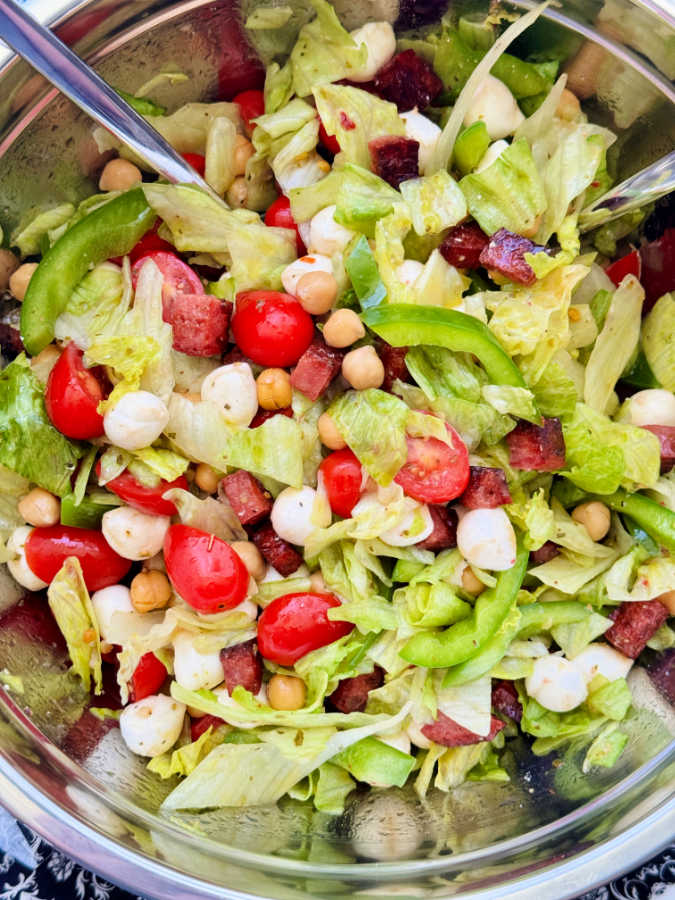 freshly tossed italian chopped salad in a serving bowl