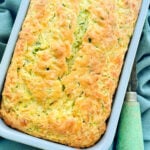 freshly baked savory zucchini bread in the pan ready to be sliced