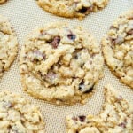 oatmeal cookies with chocolate raisins on a baking sheet