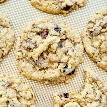 oatmeal cookies with chocolate raisins on a baking sheet