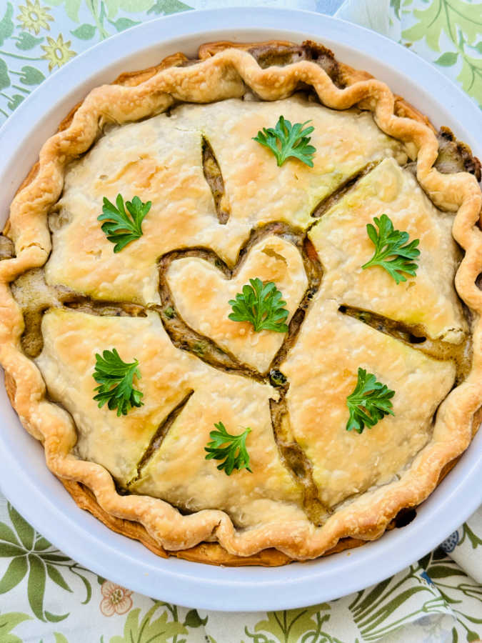 a sliced chicken pot pie ready to serve from the pie plate