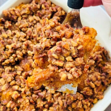 serving the first slice of pumpkin french toast from the baking dish