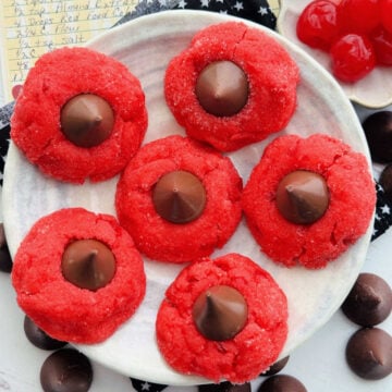 six plated cherry blossom cookies pictured with my mom's recipe card