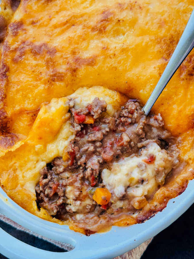 cottage pie being served from the casserole dish