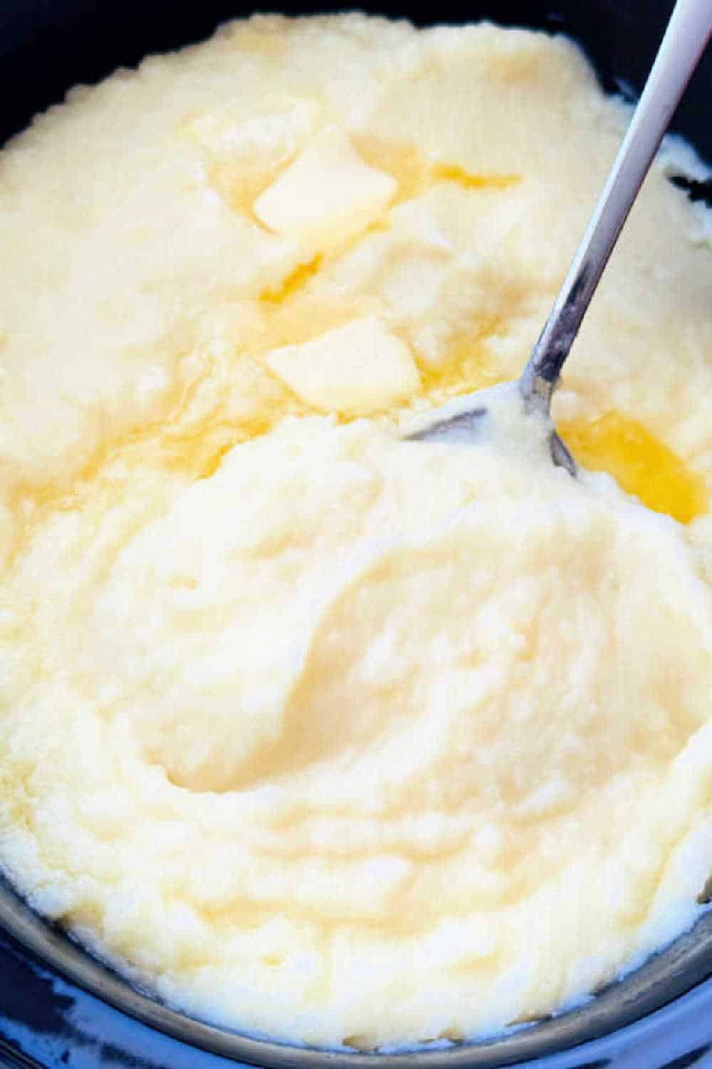 This easy creamy no boil Crockpot Mashed Potatoes recipe frees up oven space without sacrificing flavor. They are so delicious! via @foodtasticmom