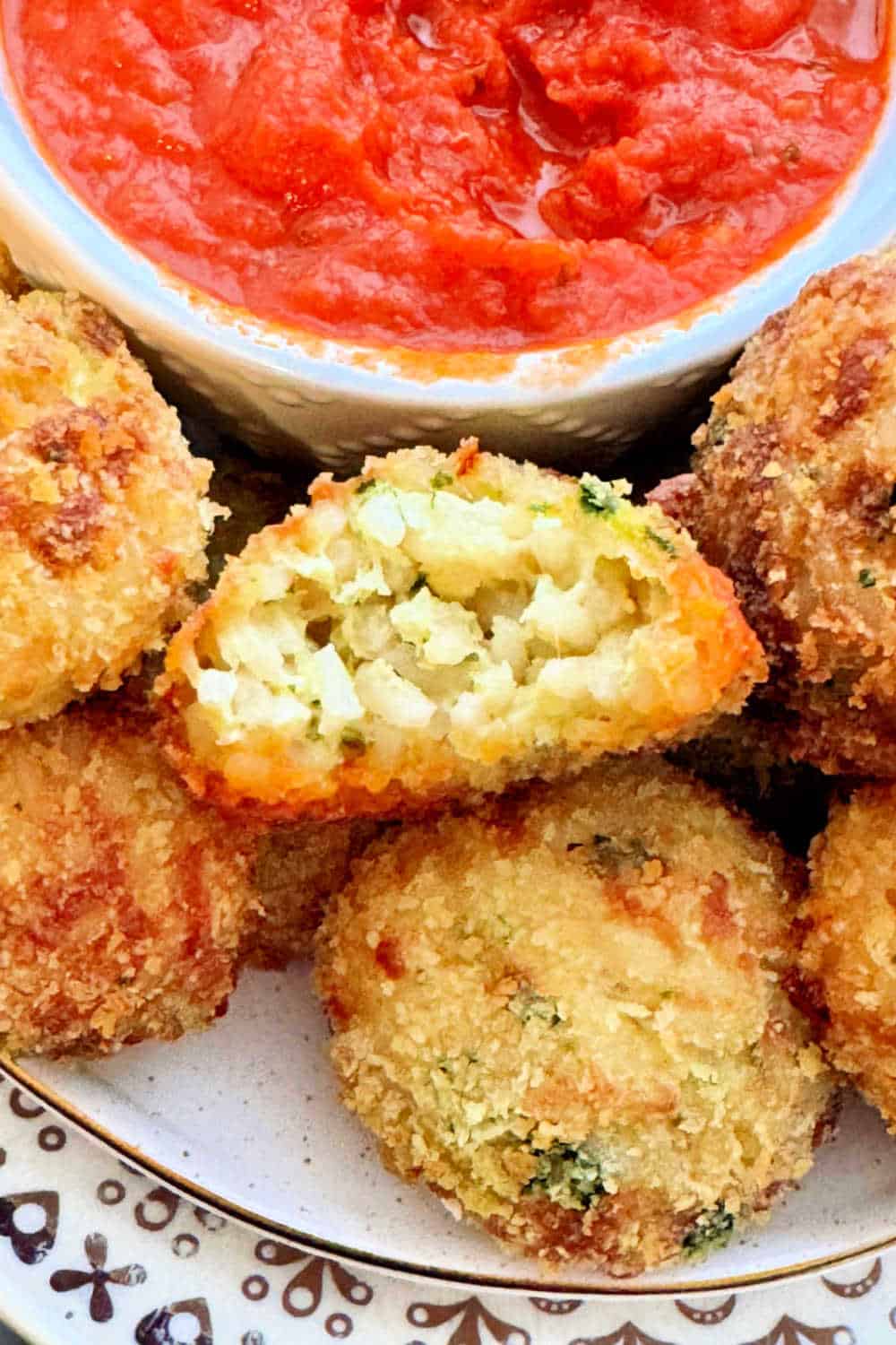 Quick and easy air fryer arancini balls are Italian style comfort food. They are a great way to use up leftover rice or cold risotto. via @foodtasticmom