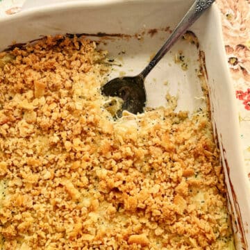 poppyseed chicken being served from a casserole dish