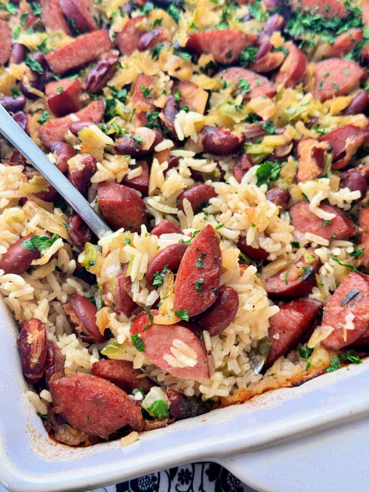 a close up picture of rice and sausage casserole