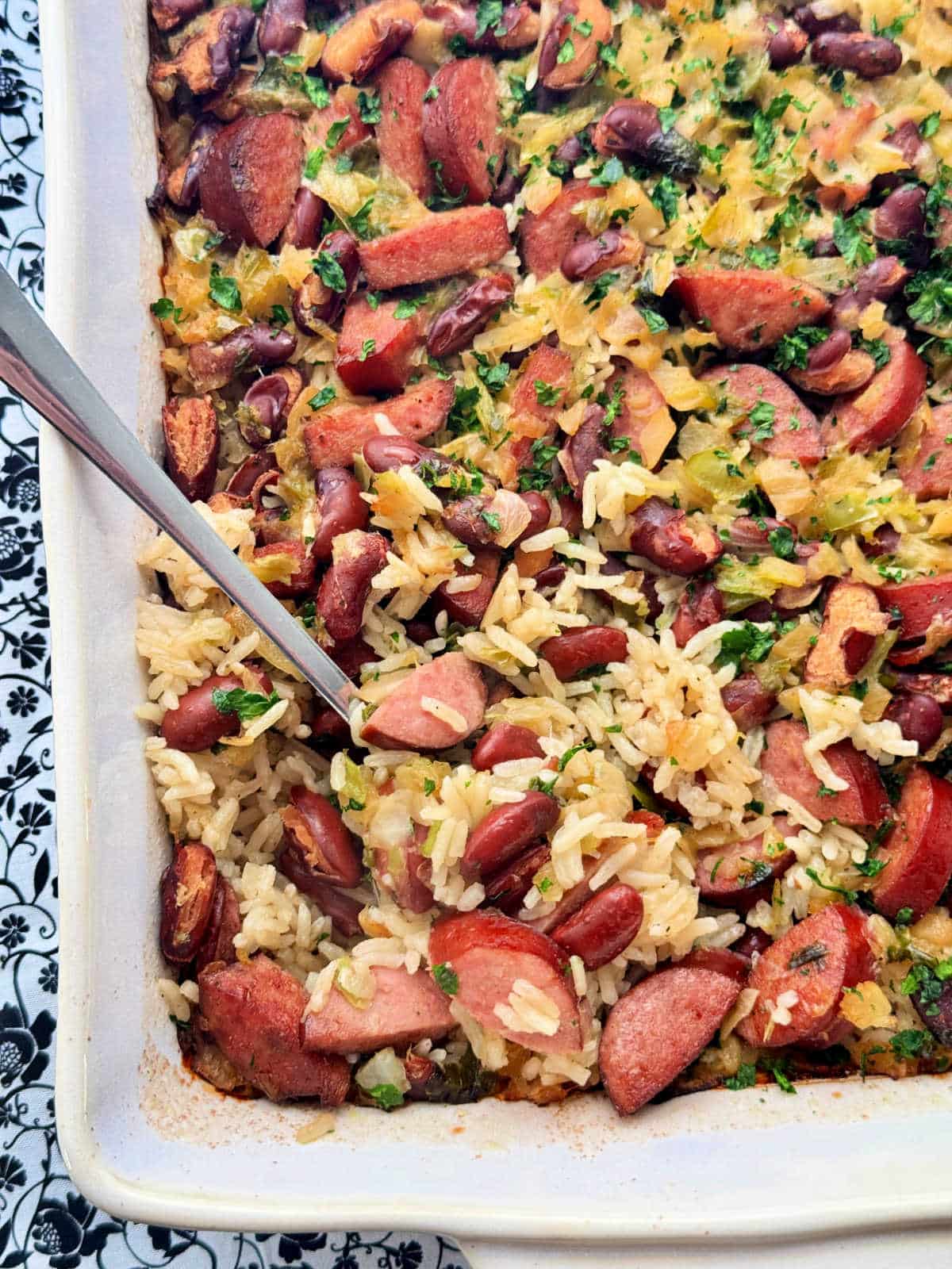 serving a spoonful of casserole from the dish