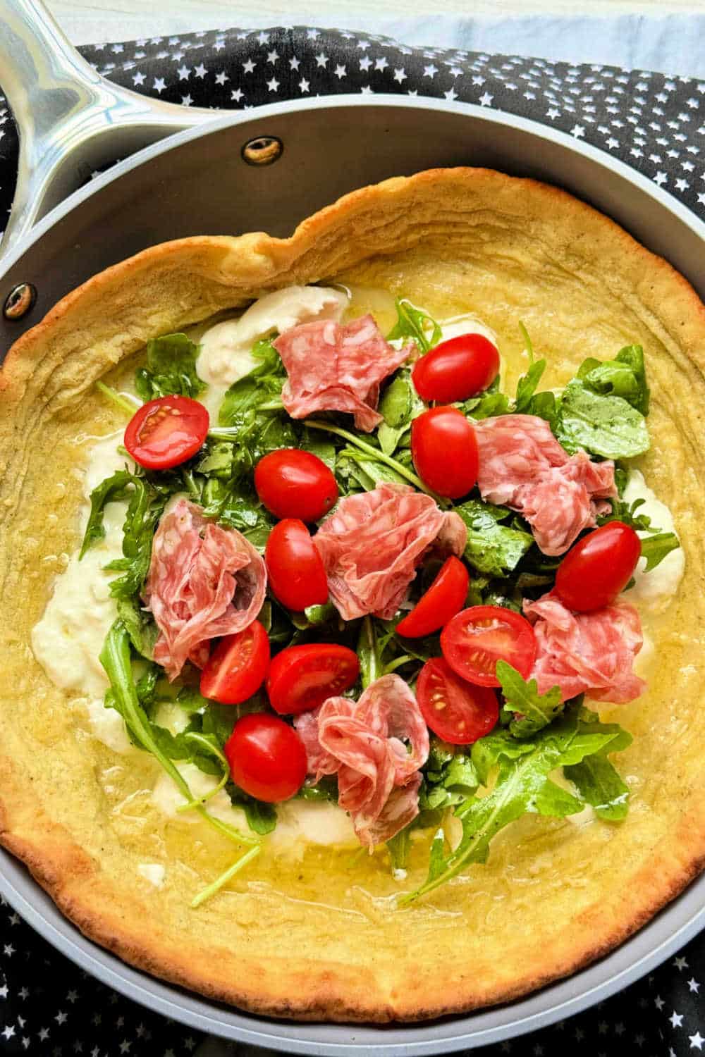 This delicious savory dutch baby pancake dressed with a simple salad can be ready to serve in just thirty minutes. via @foodtasticmom