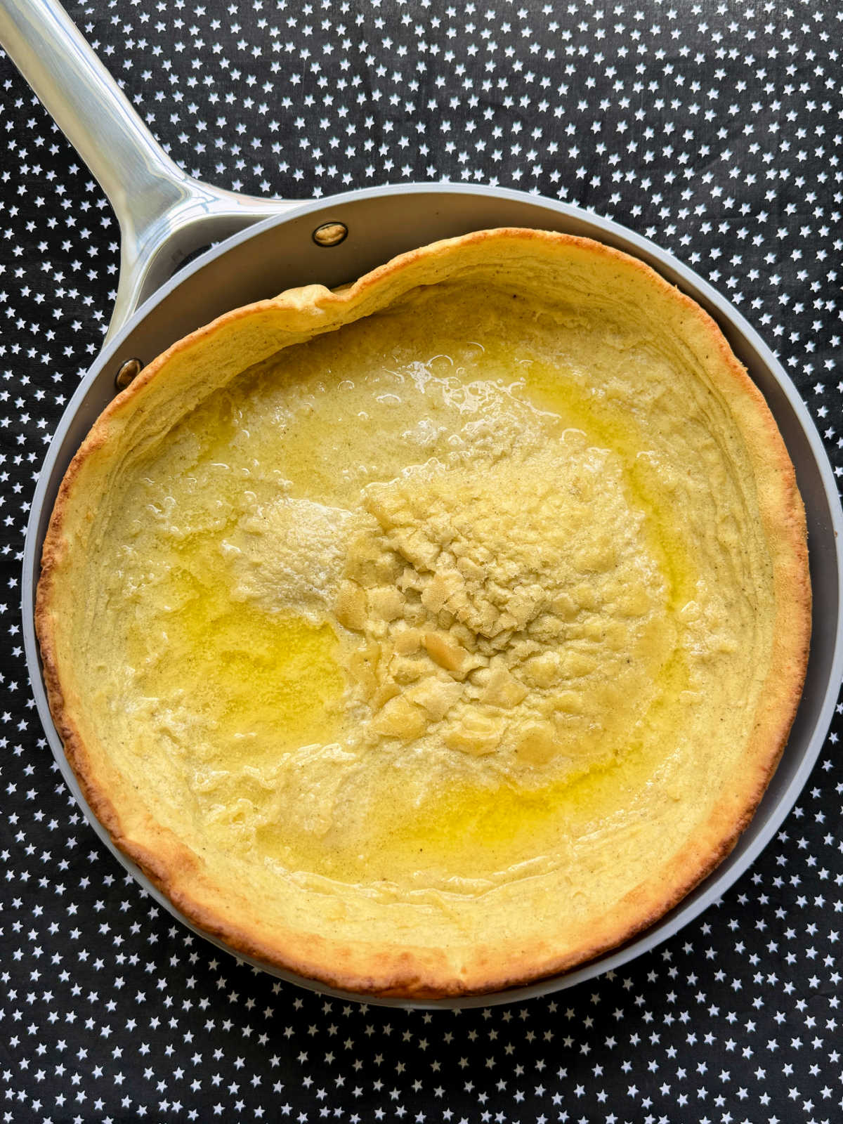 undressed savory dutch baby freshly baked in the skillet