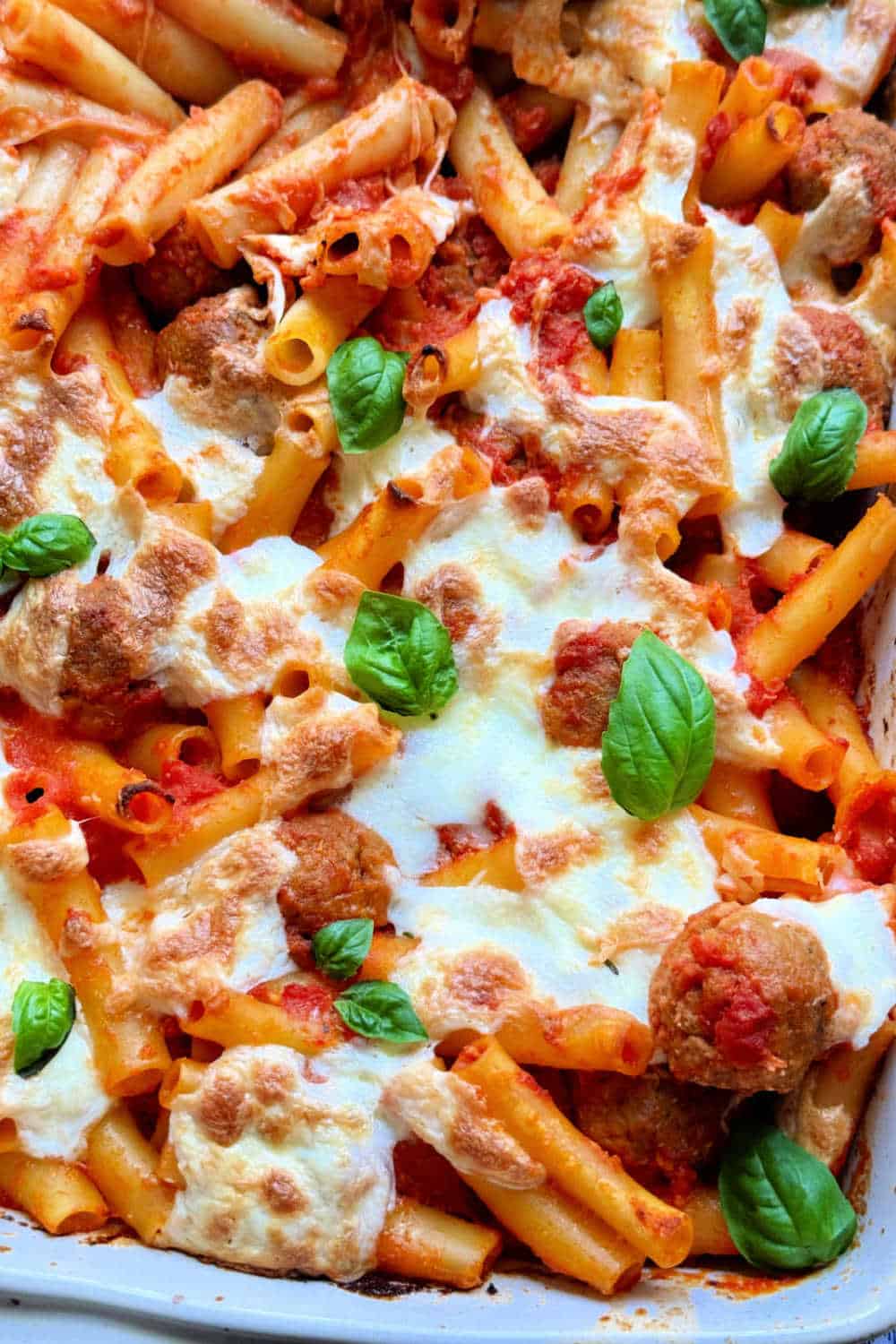 My easy baked ziti uses frozen meatballs for an easy weeknight dinner. It's quick to make but still has wonderful flavor. via @foodtasticmom