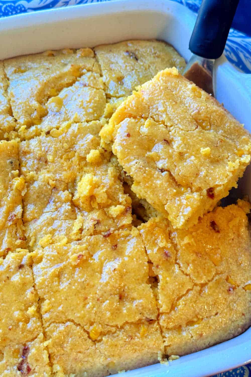 My cornbread casserole recipe is a little sweet and spicy. It includes chipotle chiles in adobo sauce plus a honey butter glaze. via @foodtasticmom