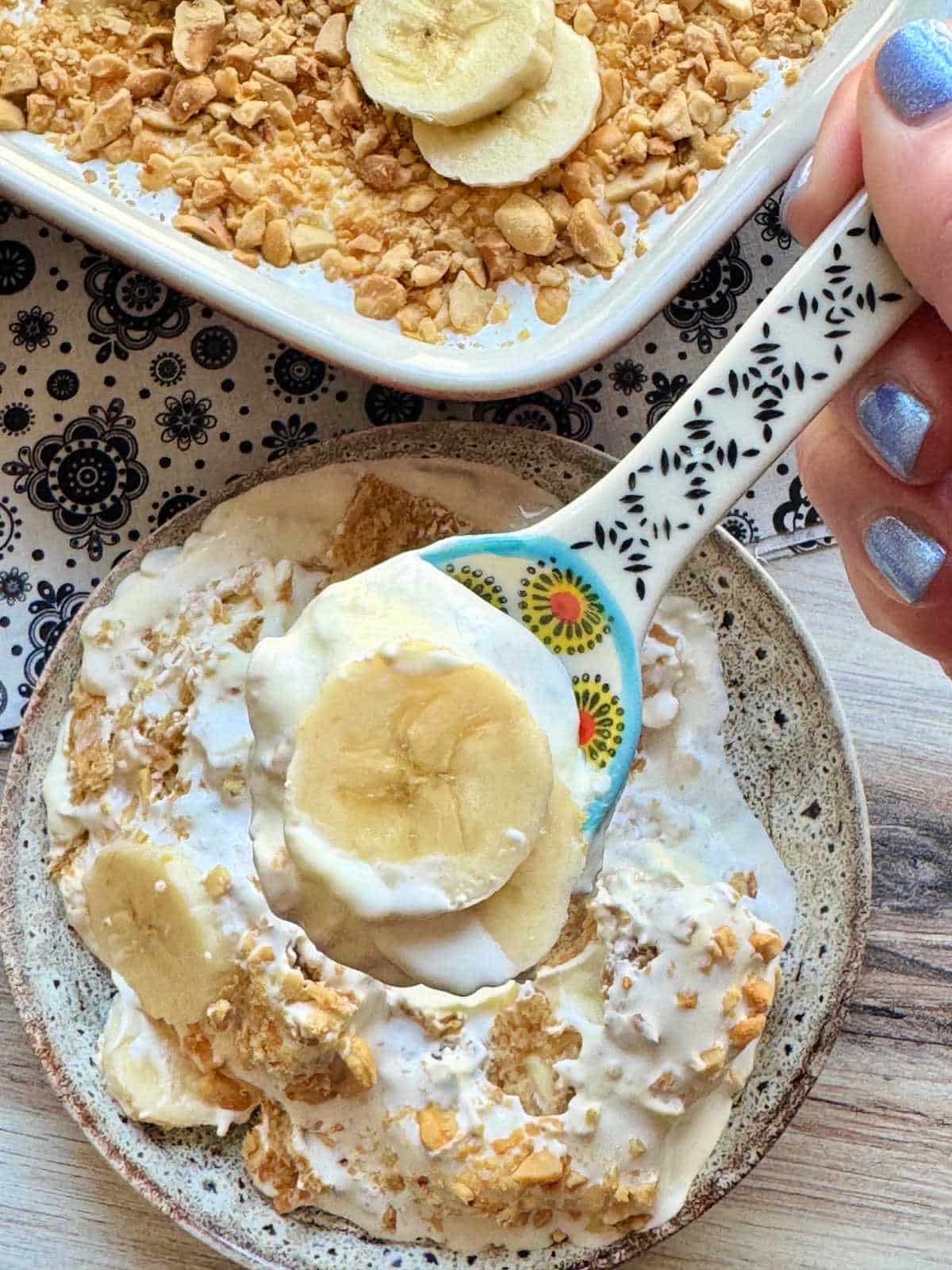 a close up photo of a spoonful of banana pudding