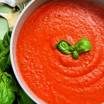 a pot full of freshly made tomato basil soup ready to serve