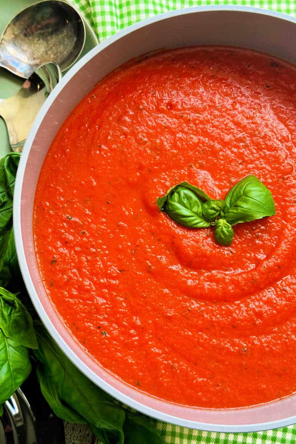 My homemade tomato basil soup is quick to make using canned crushed tomatoes and fresh basil plus white beans for a creamy texture. via @foodtasticmom