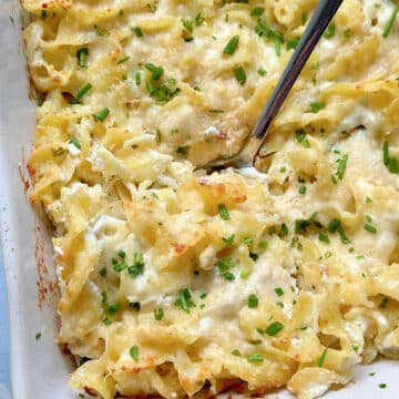a casserole dish with chicken ranch casserole and a spoon ready to serve