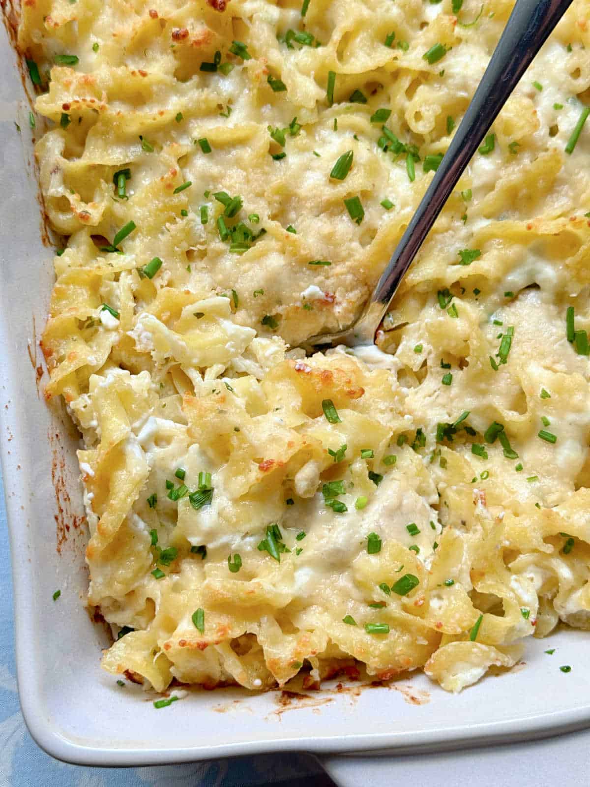 chicken ranch casserole ready to be served from its baking dish