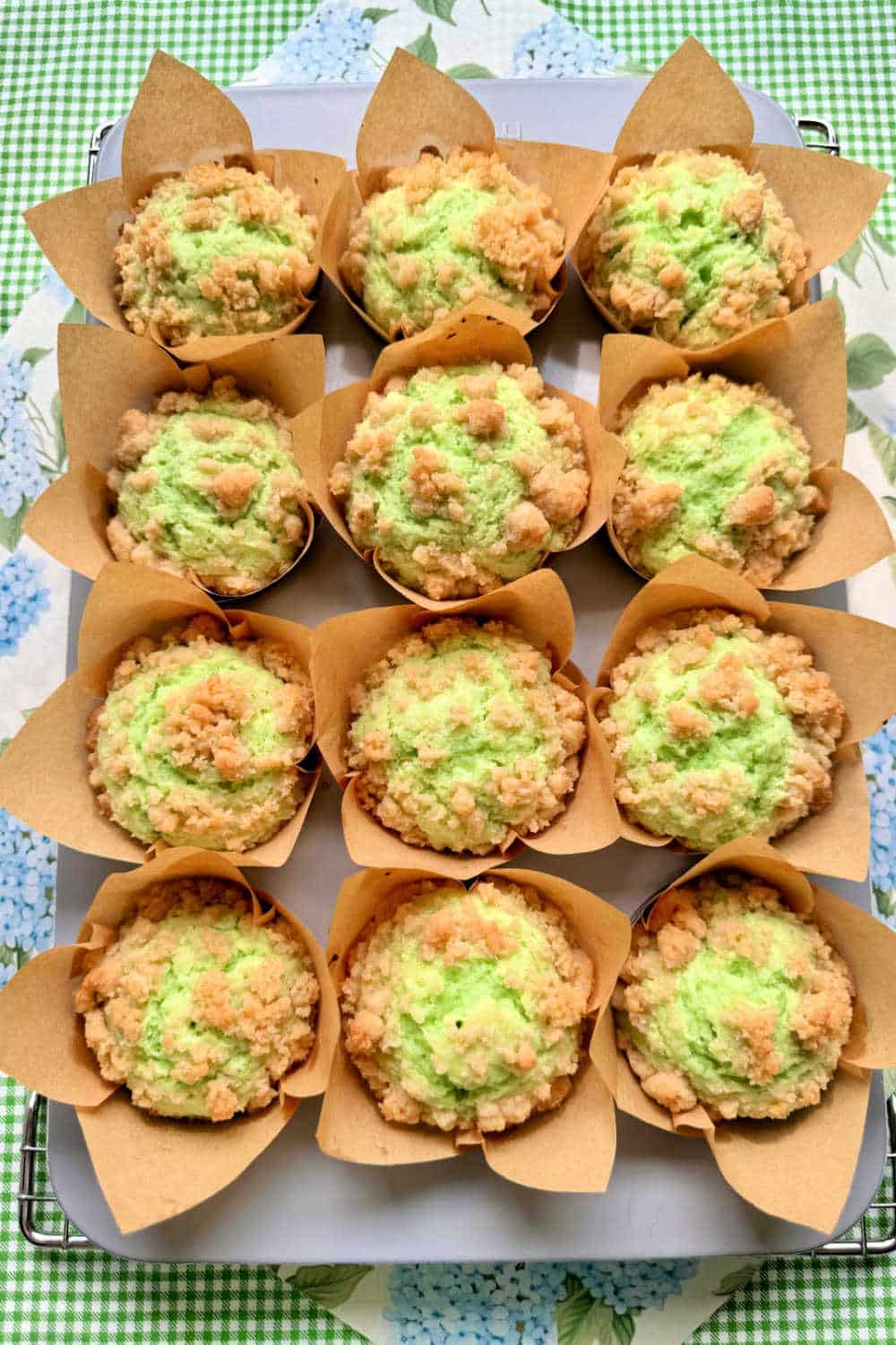 Bakery-style pistachio muffins are easy to make at home. They are a treat with their green hue, pistachio flavor and generous crunch topping. via @foodtasticmom