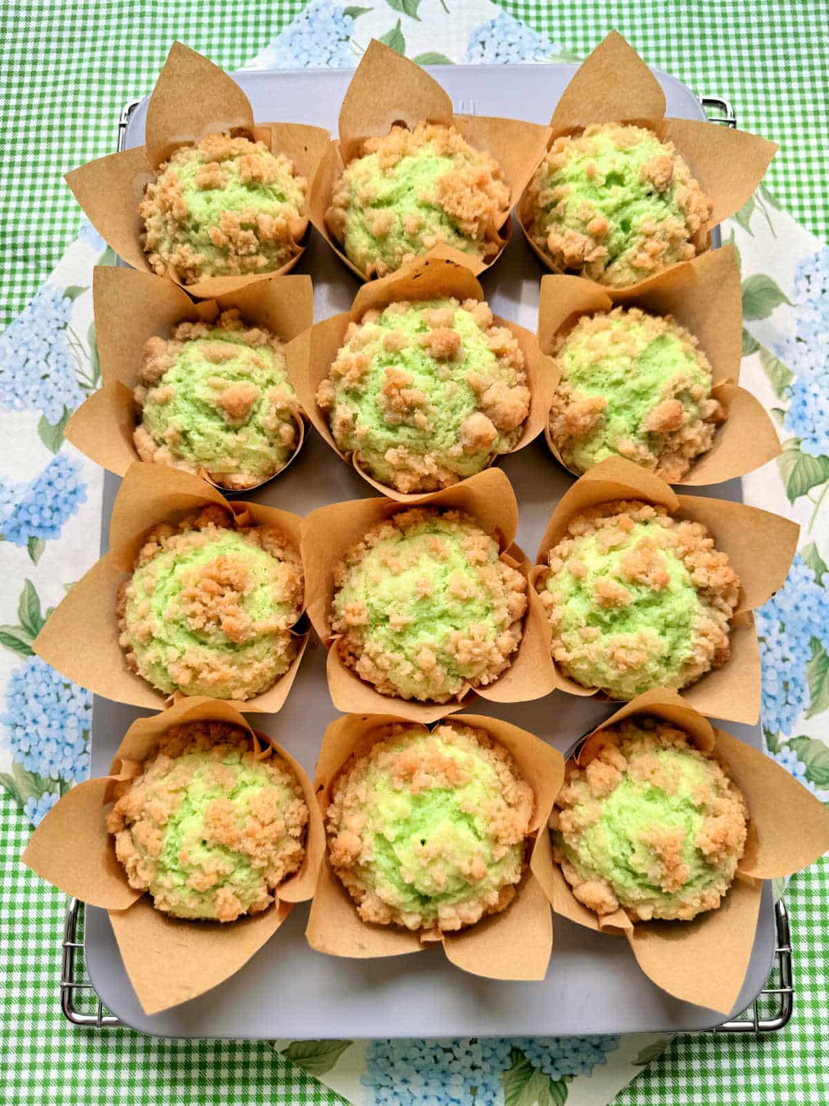 freshly baked pistachio muffins cooling in the pan