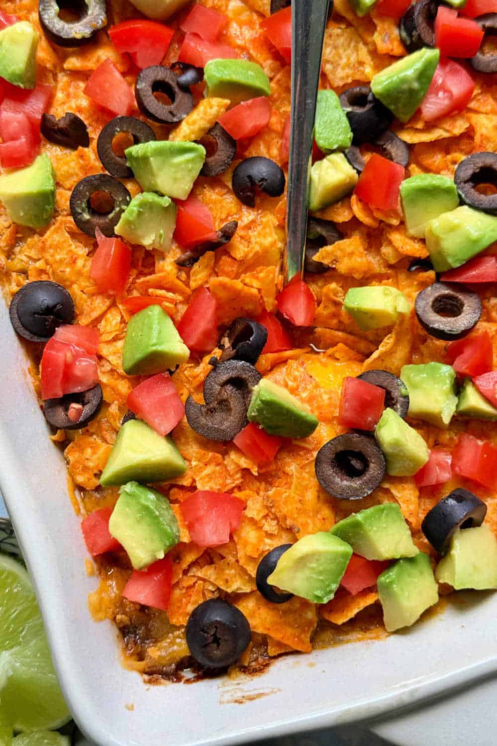 My taco hash brown casserole combines my cheesy potatoes with taco seasoned ground beef and taco toppings. It's comforting and kid friendly. via @foodtasticmom