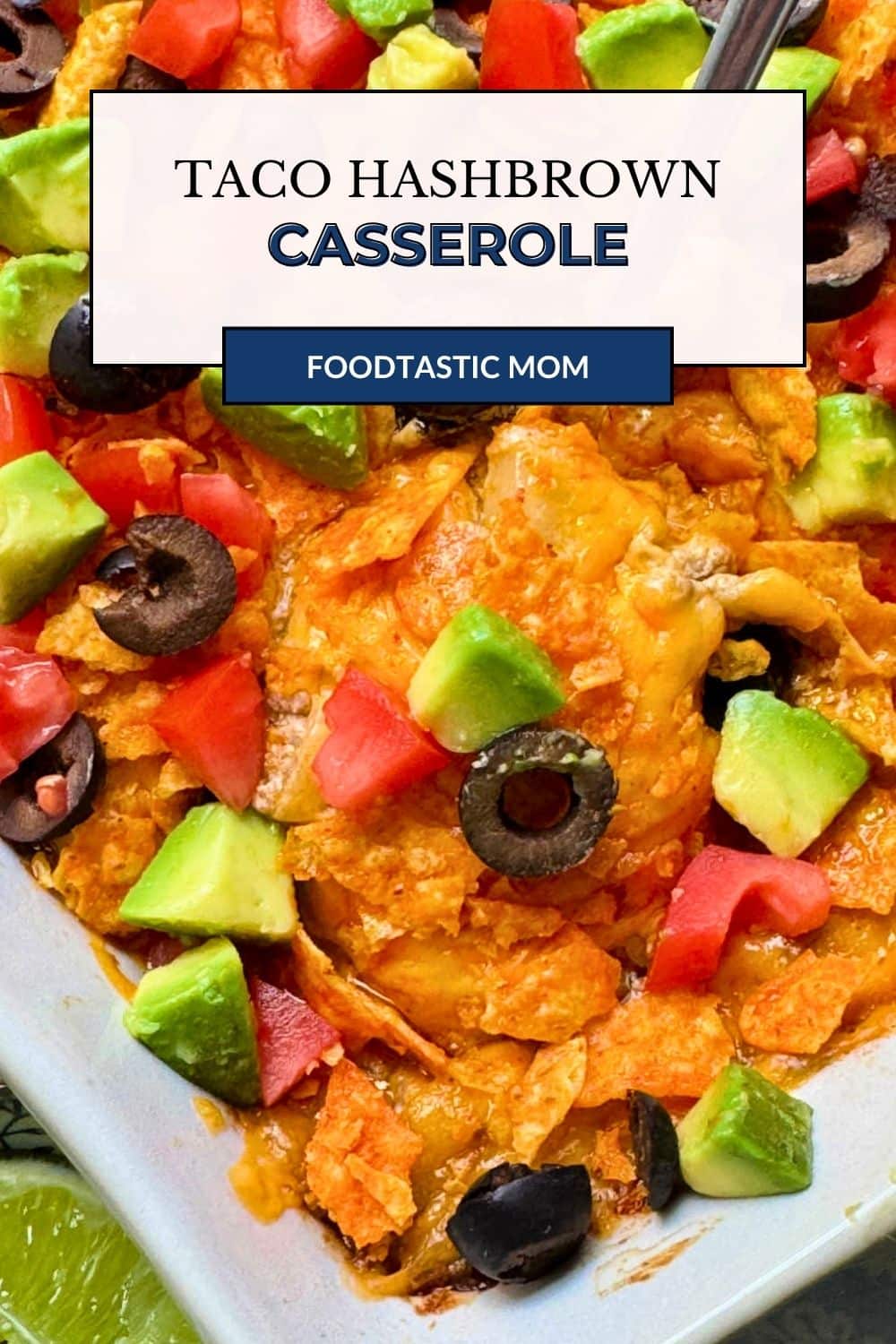 My taco hash brown casserole combines my cheesy potatoes with taco seasoned ground beef and taco toppings. It's comforting and kid friendly. via @foodtasticmom