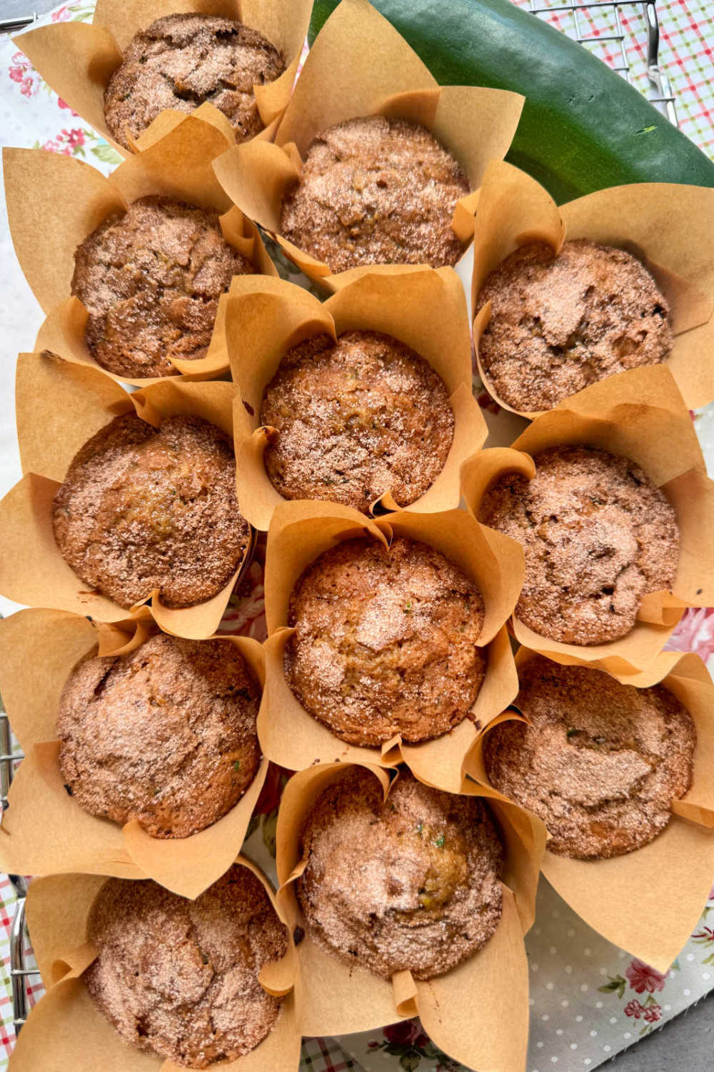My zucchini muffin recipe bridges summer to fall with fresh shredded zucchini and raisins in a tender muffin topped with warm cinnamon sugar. via @foodtasticmom