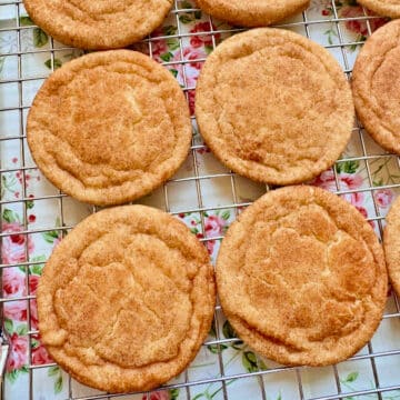 flat lay picture of four freshly baked snickerdoodles on a wire rack