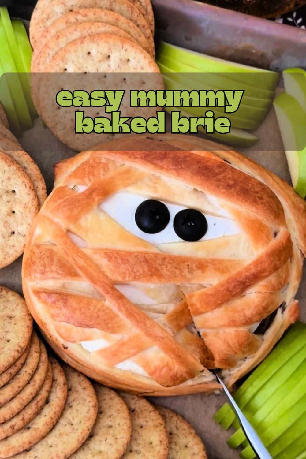 Mummy brie is a simple and spooky appetizer. Mushrooms and onions browned in butter stuffed inside brie wrapped in puff pastry strips. via @foodtasticmom