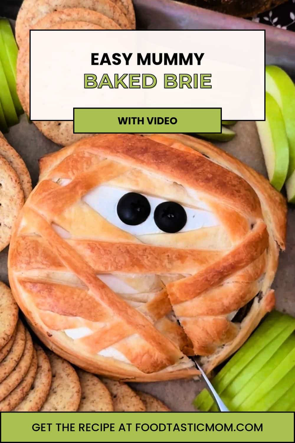 Mummy brie is a simple and spooky appetizer. Mushrooms and onions browned in butter stuffed inside brie wrapped in puff pastry strips. via @foodtasticmom
