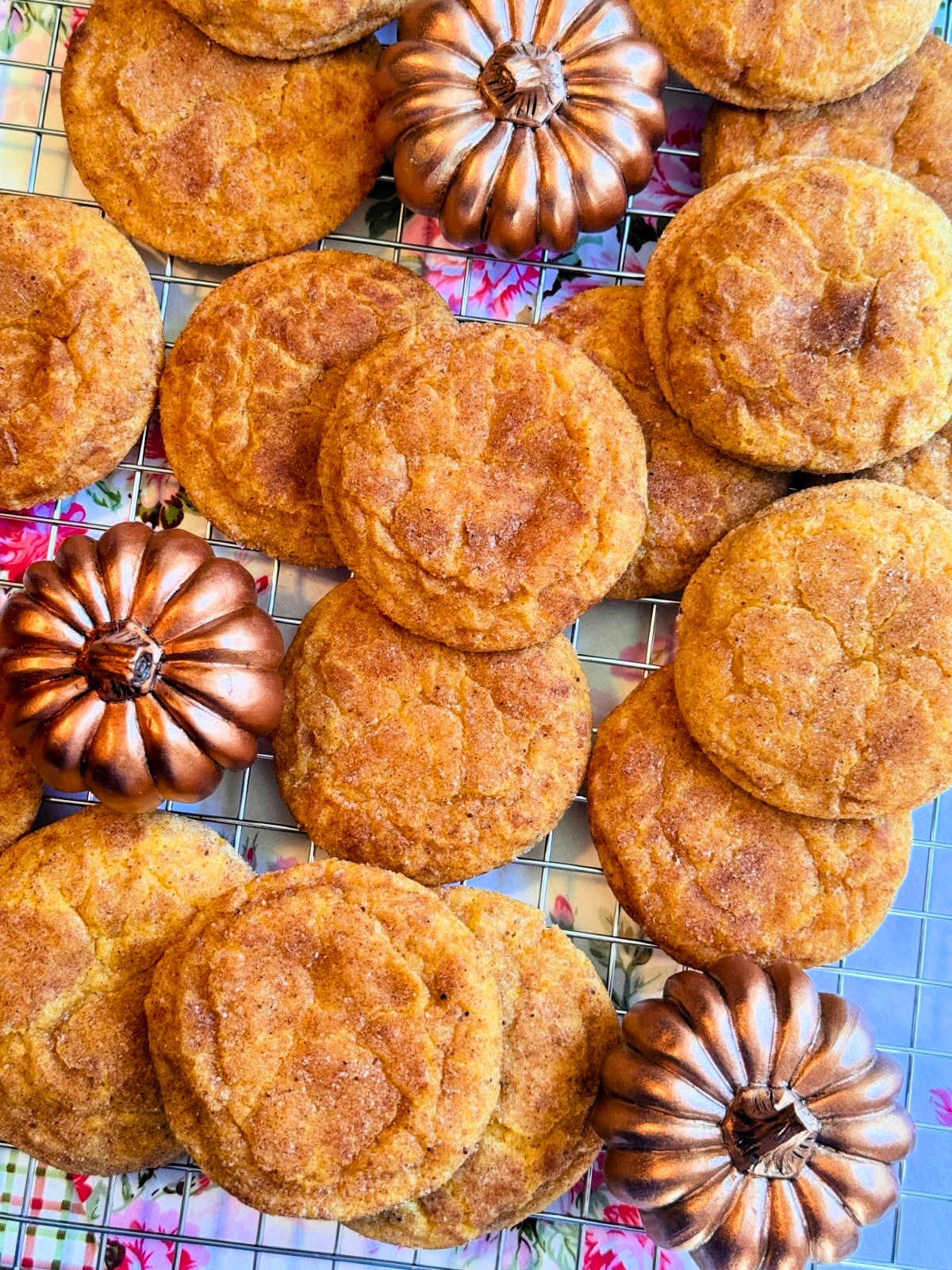 freshly baked pumpkin spice cookies cooling on a wire rack