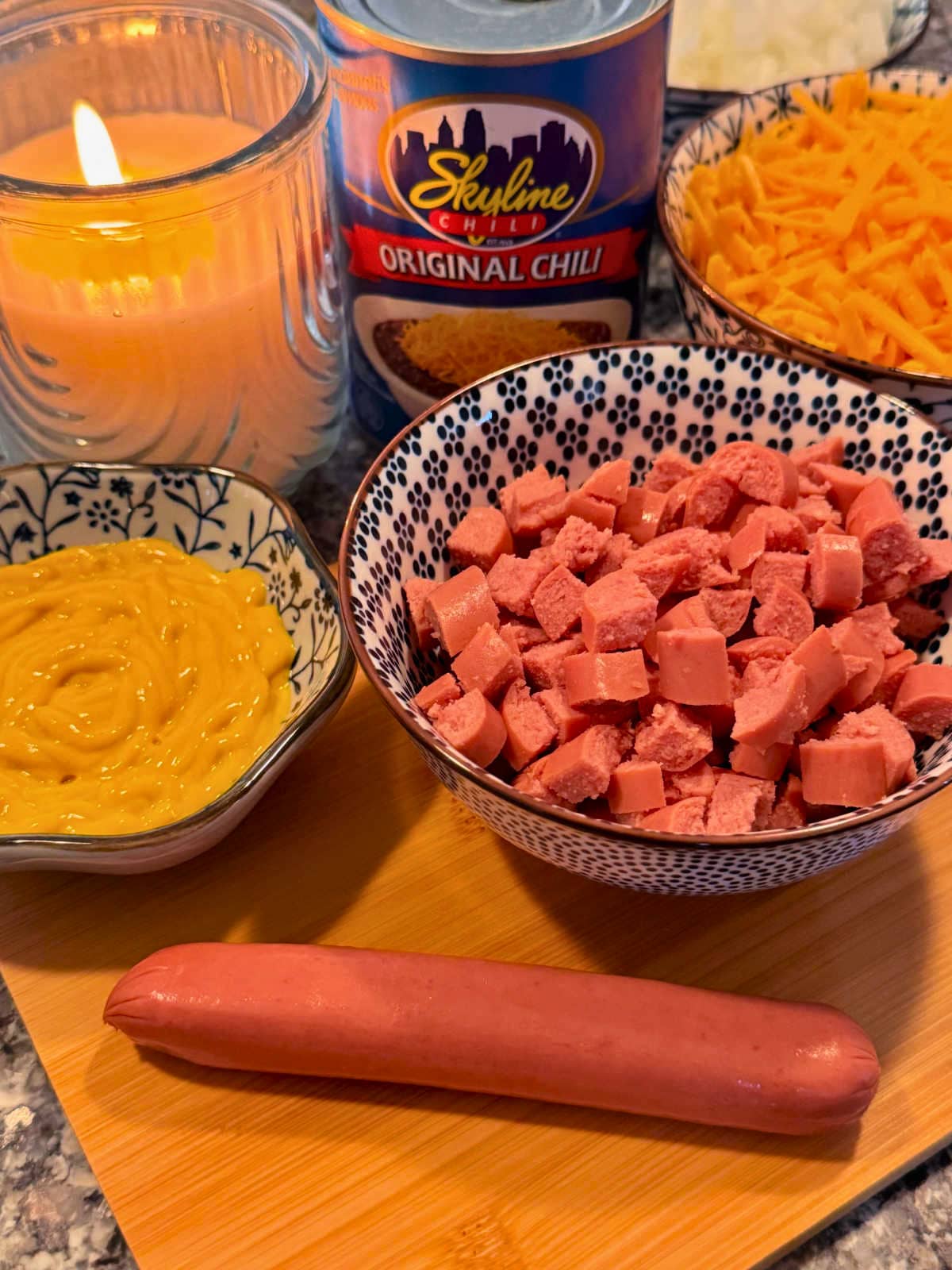 showing the hot dogs being chopped for the skyline chili dip