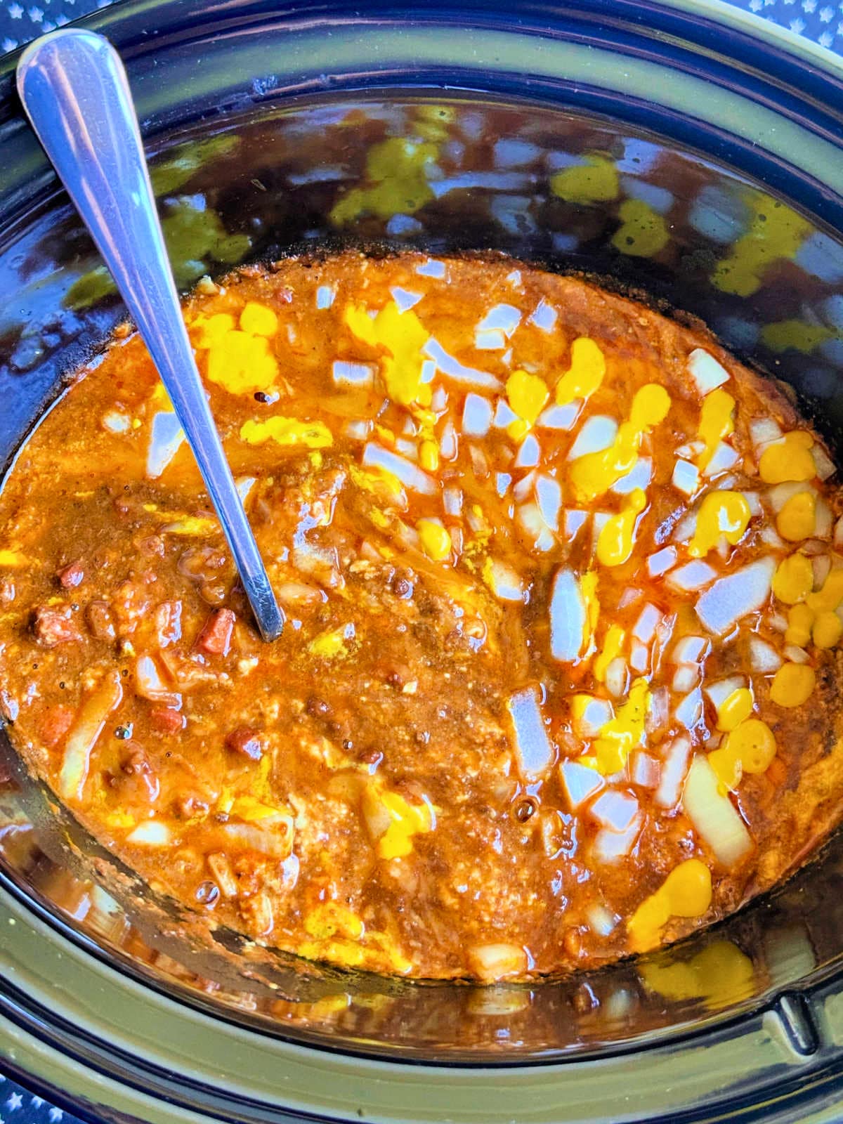 skyline chili dip ready to be served from the slow cooker