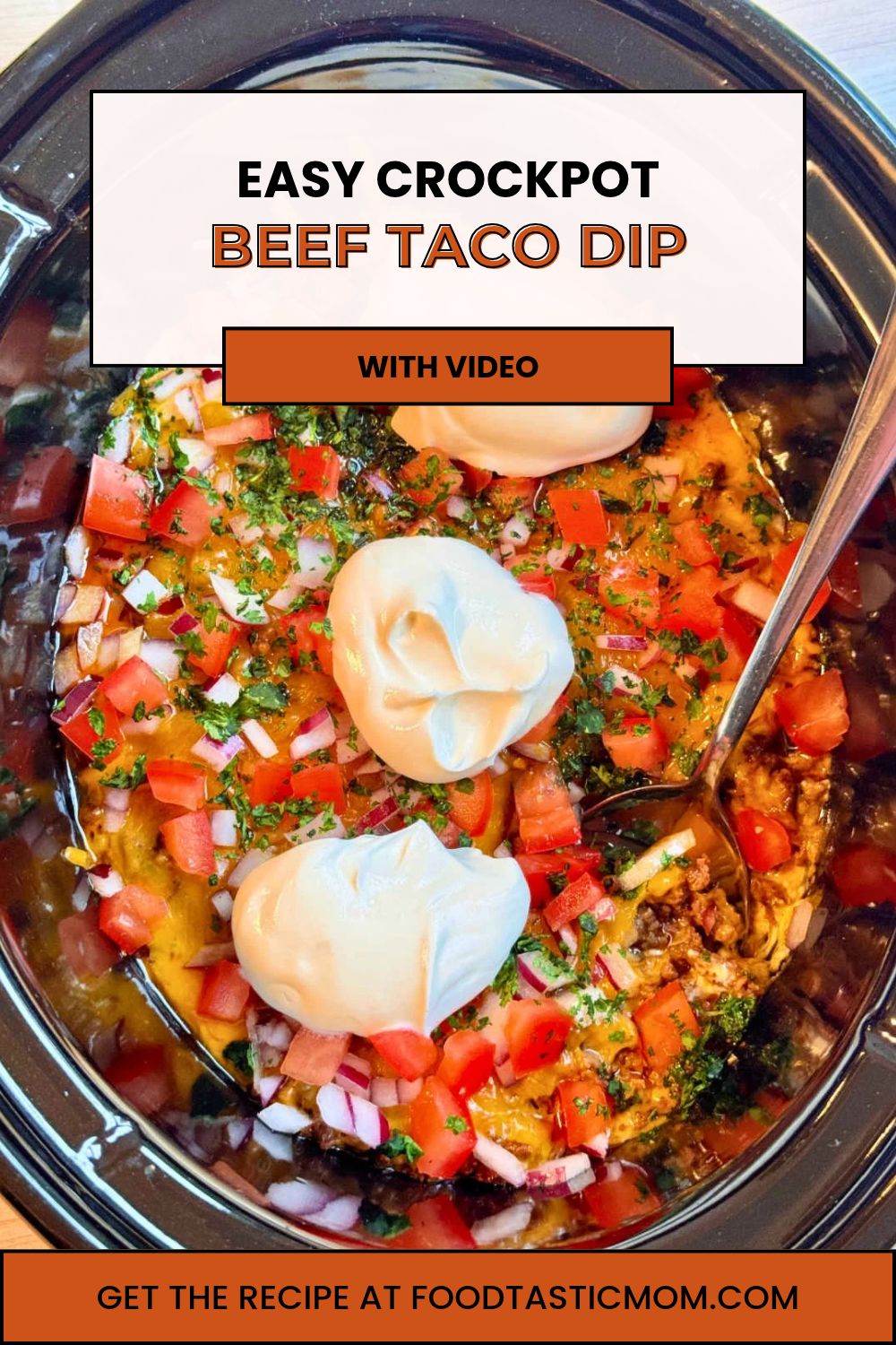 My viral pizza dip for the slow cooker inspired me to create this Crock-Pot Taco Dip. It's a tasty appetizer to feed a game day crowd. via @foodtasticmom