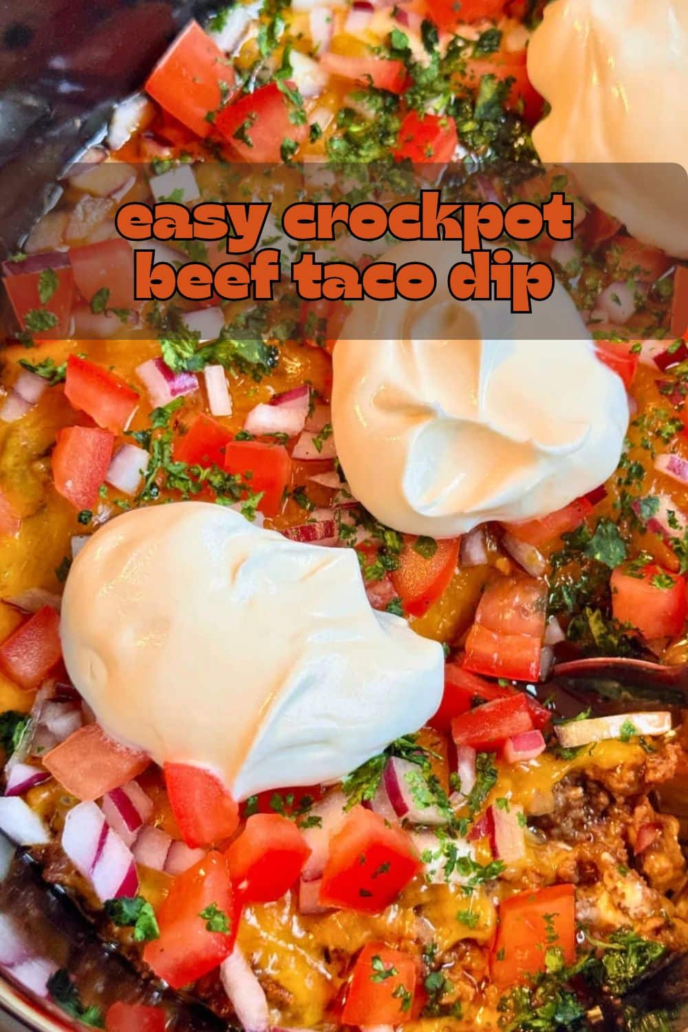 My viral pizza dip for the slow cooker inspired me to create this Crock-Pot Taco Dip. It's a tasty appetizer to feed a game day crowd. via @foodtasticmom