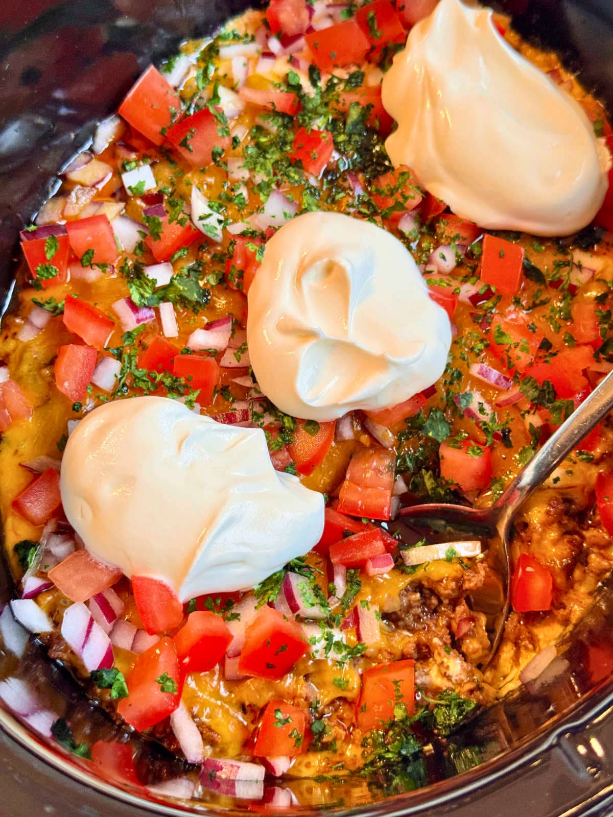 taco dip ready to serve from the crockpot
